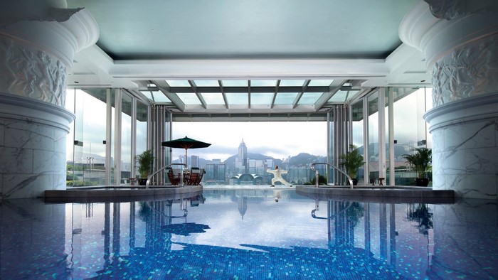 Indoor swimming pool with city view at The Peninsula Hong Kong