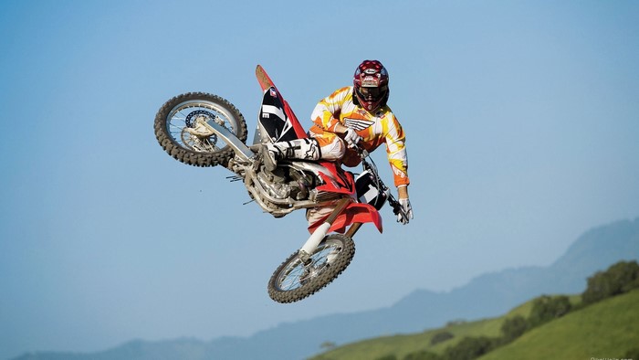 Motocross rider performing a jump