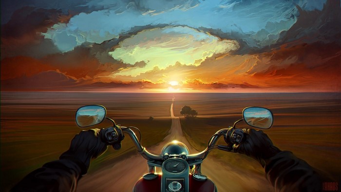 Motorcycle ride towards sunset on a country road