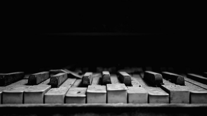 Close-up of old, dusty piano keys
