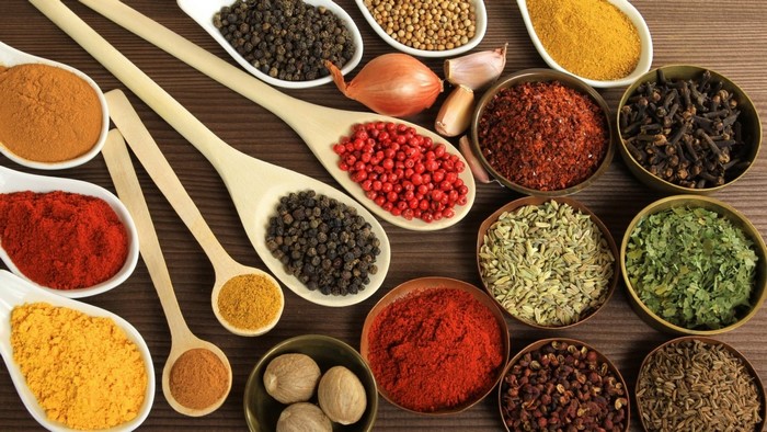 Assortment of Spices in Bowls and Spoons