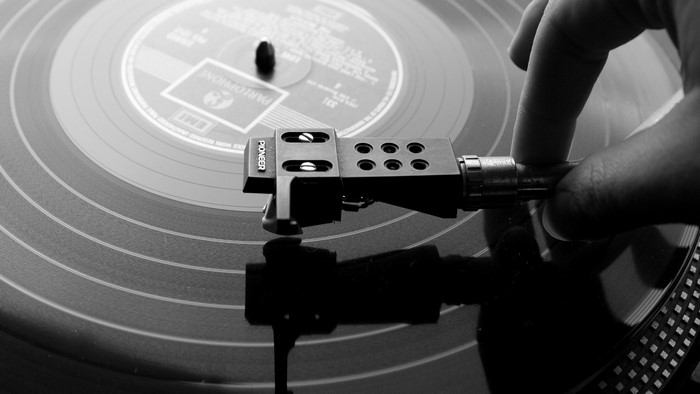 Pioneer Turntable with Hand on Tonearm