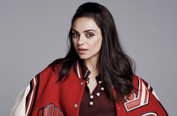 Mila Kunis in a red varsity jacket