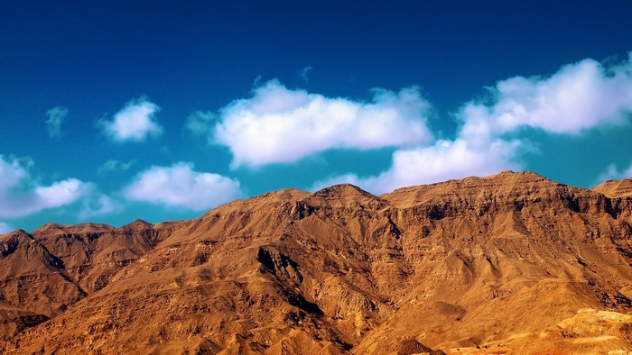 Desert Mountains Under a Blue Sky with Clouds