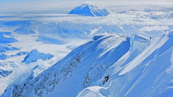 Denali Summit with Climbers and Clouds