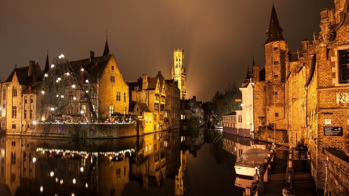Bruges at night with canal and buildings