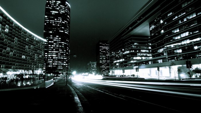 Dark Cityscape at Night with Light Trails