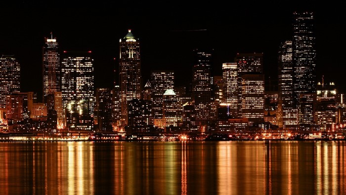 Cityscape at Night with Water Reflection
