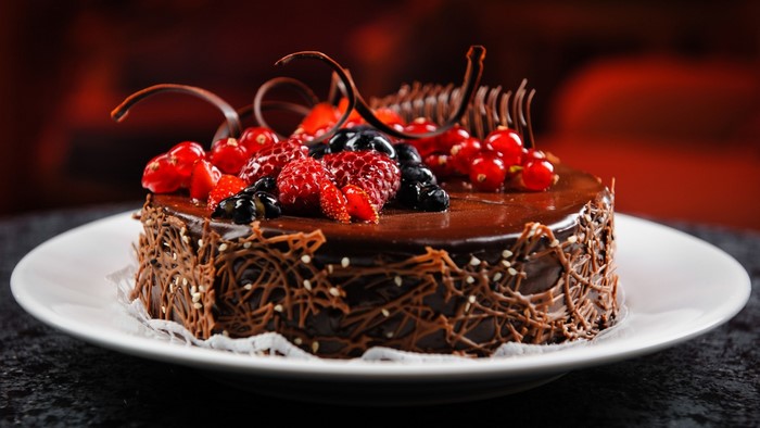 Chocolate cake with berries and chocolate decorations