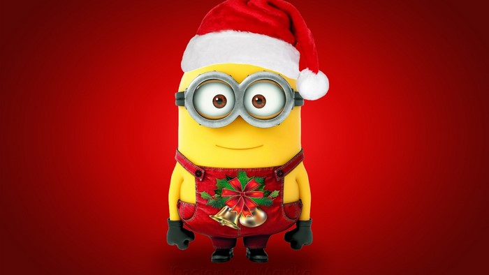 Christmas Minion wearing Santa hat and festive overalls