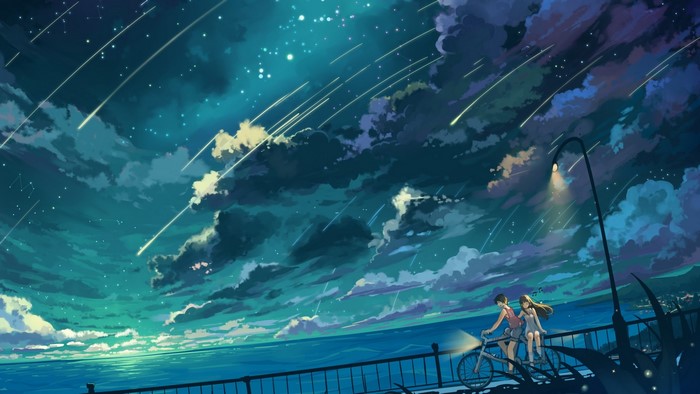 Couple on a bicycle under a starry sky