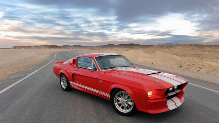 Red Shelby GT 500 Mustang on a Desert Road