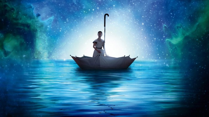 Girl in an umbrella boat sailing on a starry sea
