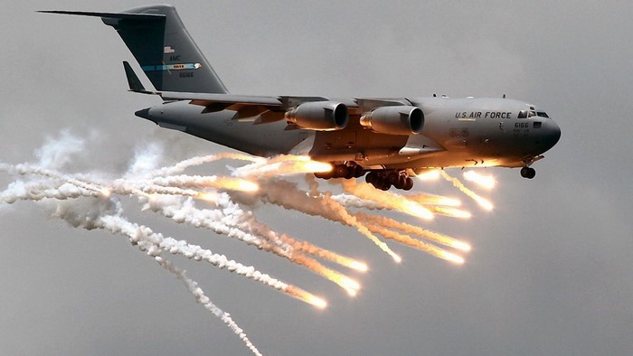 C-17 Globemaster III aircraft deploying flares