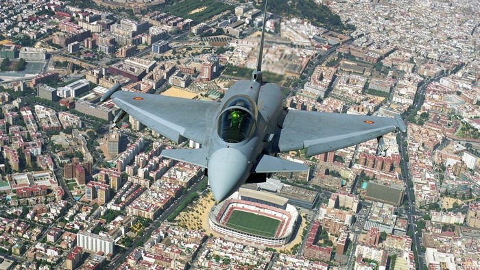 Eurofighter Typhoon flying over a city