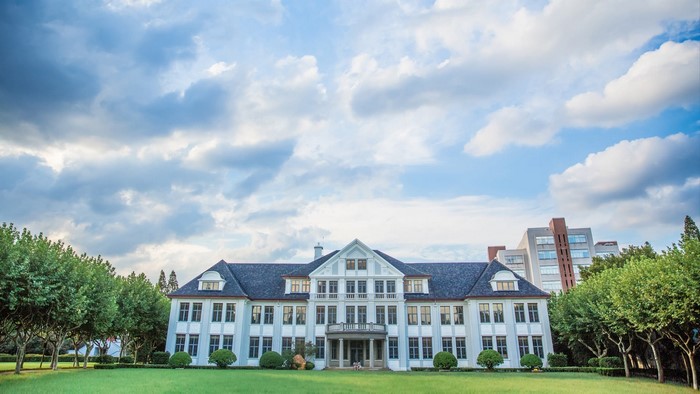 Fudan University building with trees and sky