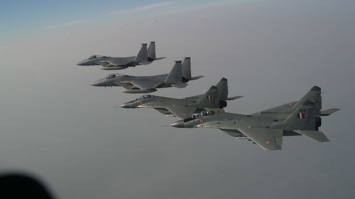 Four fighter jets flying in formation