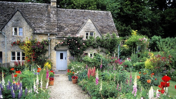 English cottage with a vibrant flower garden