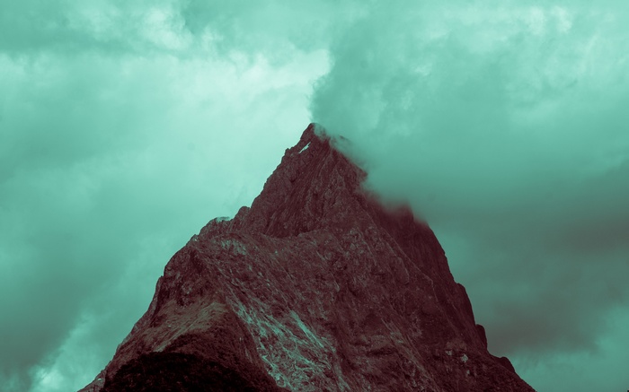 Mountain peak shrouded in clouds