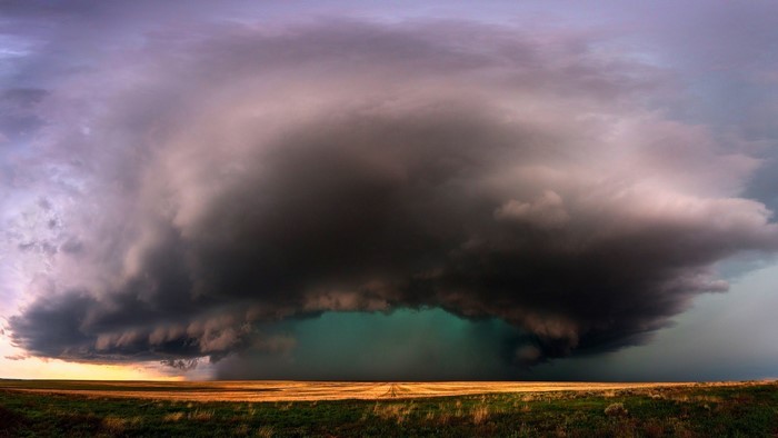 4K storm clouds over a field