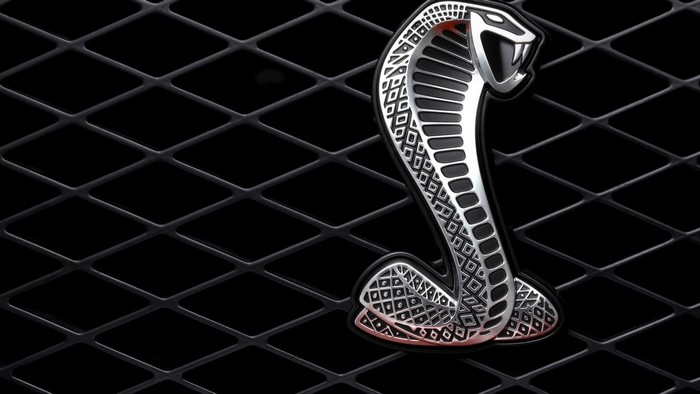 Ford Mustang Cobra emblem on a black grille