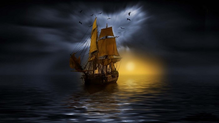 Sailboat on the ocean at sunset