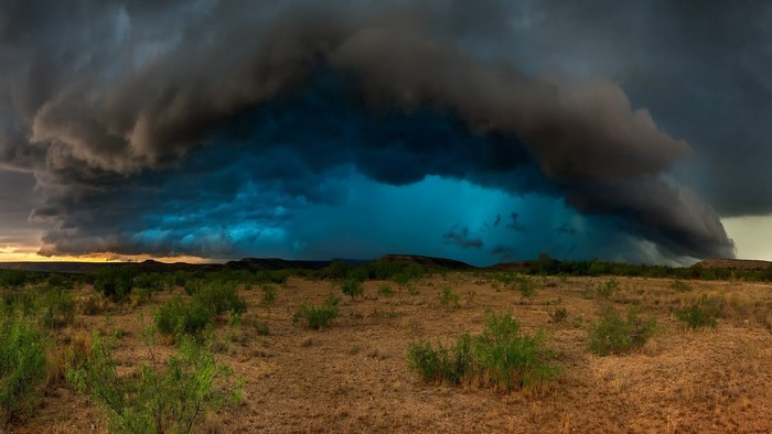Massive storm clouds over a dry landscape