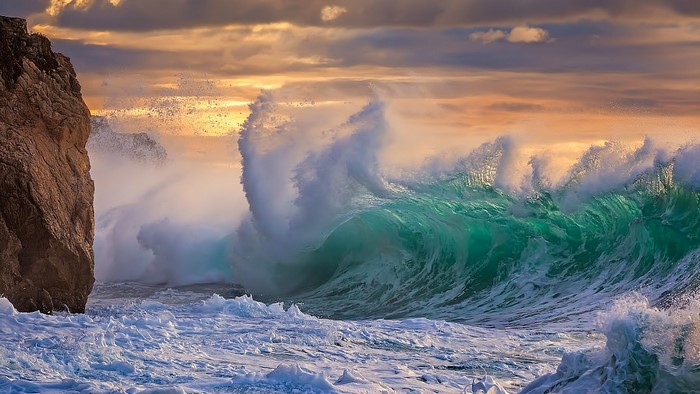 Crashing Ocean Wave Against Rocky Shore