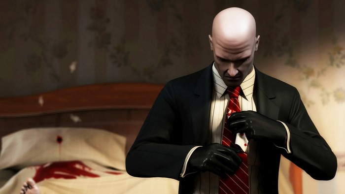 Agent 47 from Hitman: Blood Money adjusts his tie
