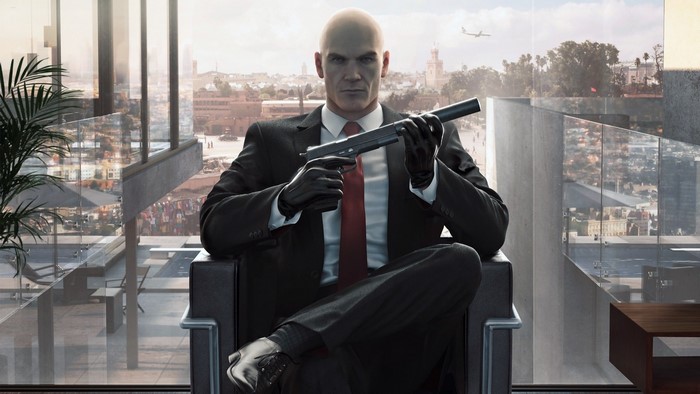 Agent 47 from Hitman holding a pistol