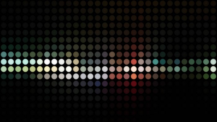 Abstract pattern of colored circles on a black background