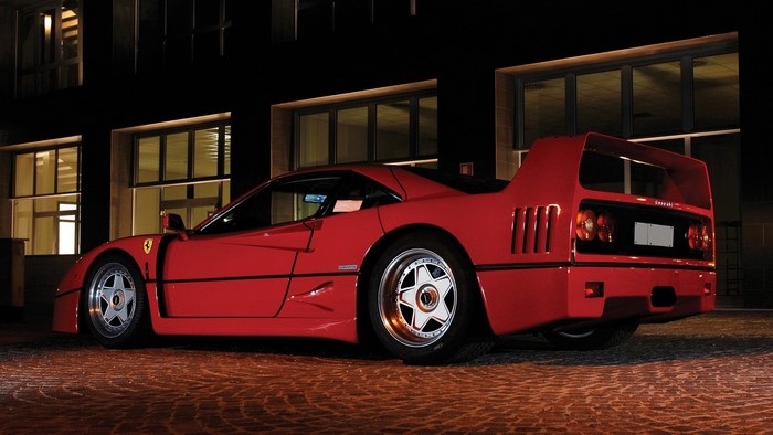 Red Ferrari F40 parked at night