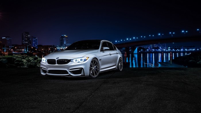 Silver BMW M3 Sedan at Night Cityscape