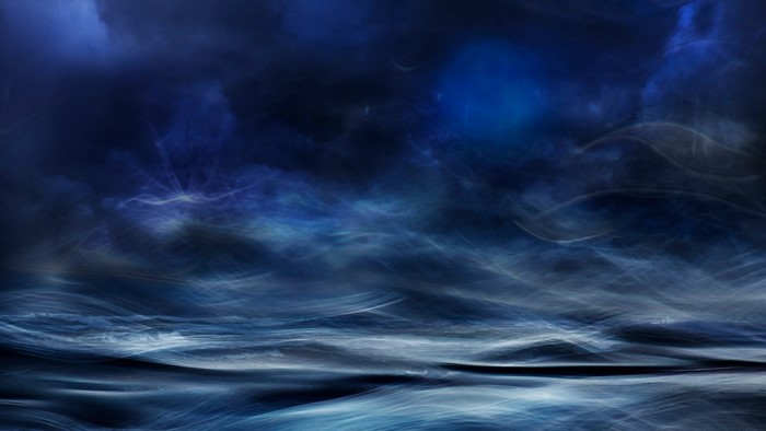 Abstract dark blue ocean waves and clouds