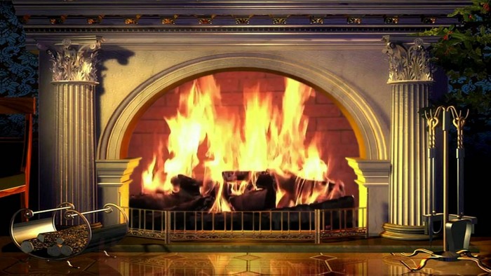 Fireplace with burning logs and ornate columns