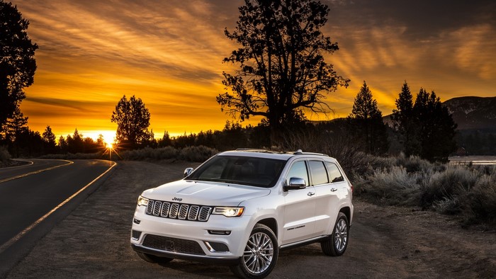 White Jeep Grand Cherokee on a Road at Sunset