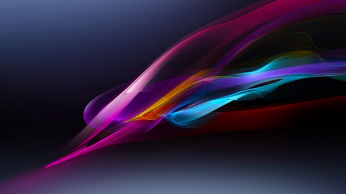 Abstract colorful light streaks on dark background