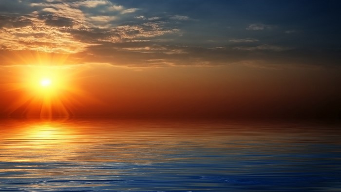 Sunset over the sea with reflection