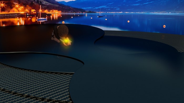 Person holding a glowing orb by a lake at night