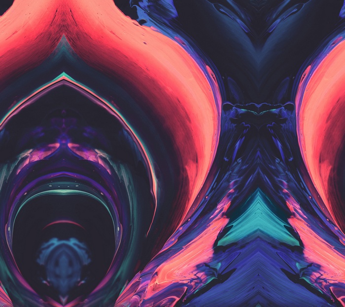 Abstract paint flow with pink, blue, and teal colors