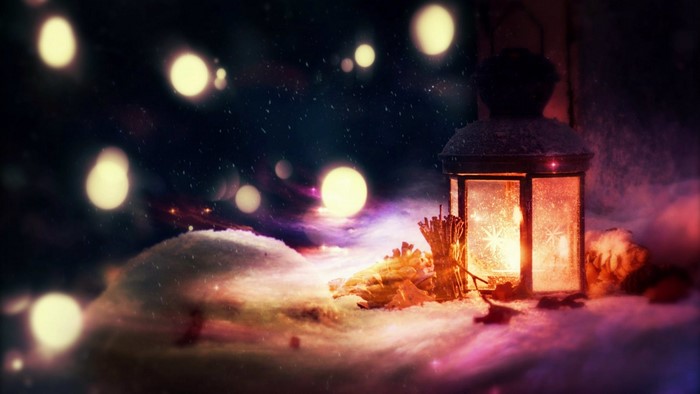 Lantern in the snow with bokeh lights