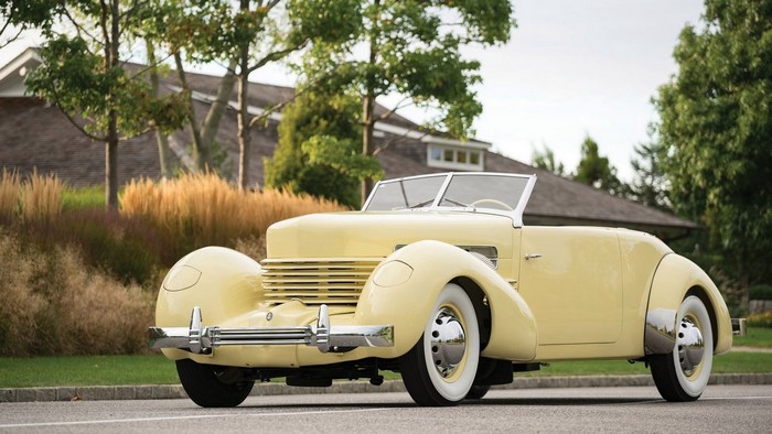 Yellow 1930s Cord Convertible Car