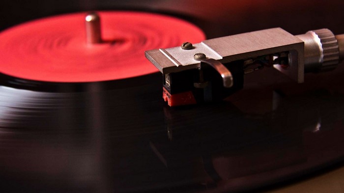 Red vinyl record on a turntable