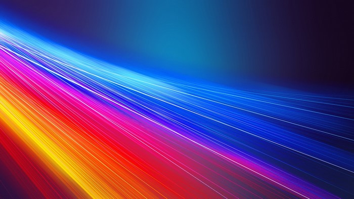 Multicolored light streaks on a dark blue background