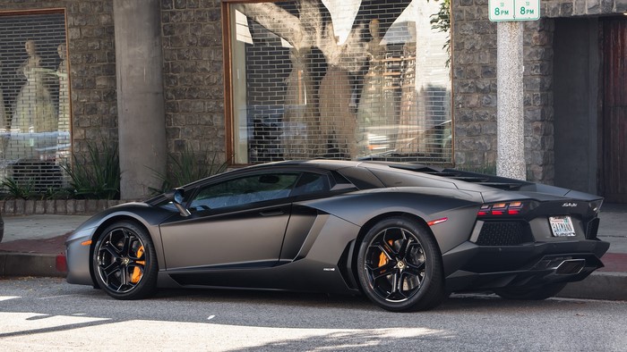 Matte black Lamborghini Aventador LP 700 parked on street