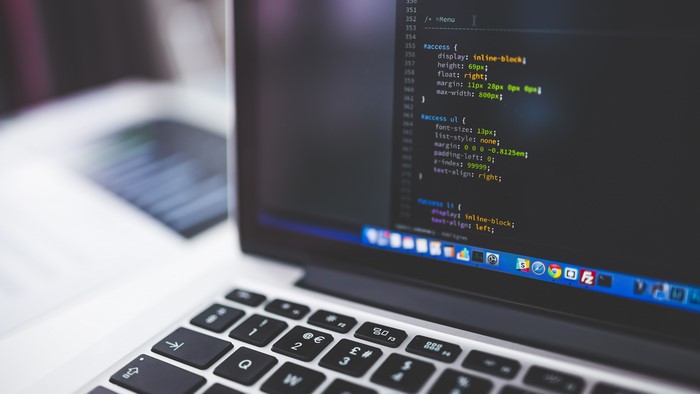 4K MacBook displaying code