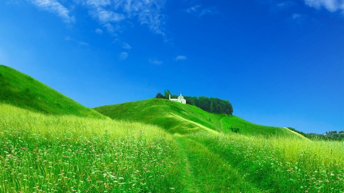 Green hills with a white church on top