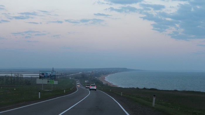Road along the sea near Kerch at dusk