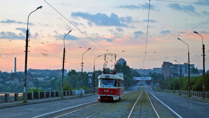 Tram 936 on a bridge in Donetsk at sunrise