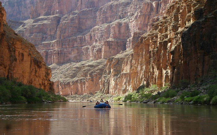 Rafting down a river in a grand canyon